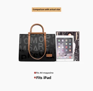 Large black leather tote showing spacious interior for A4 magazines and iPad