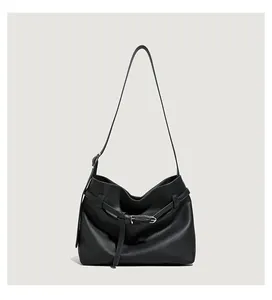 Detailed close-up of premium black lychee texture leather with silver metal buckle