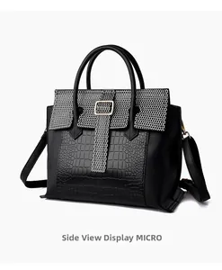 Detail view showing black and white faux leather textures with crocodile and honeycomb patterns
