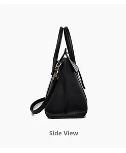 Side view of black lychee grain tote bag with wide base and decorative tag