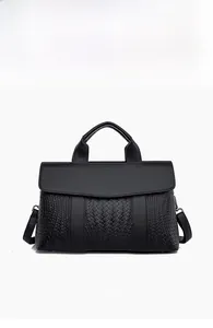 Front view of black woven texture handbag with top handle and adjustable strap