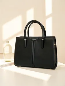 Elegant black faux leather tote bag with Muse Bag logo and stylish gold metal accents