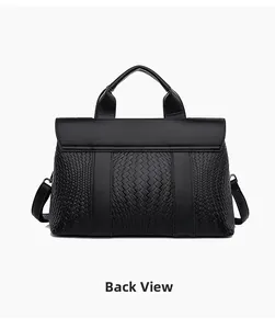 Rear view of black woven tote bag with premium pebbled leather texture and metal rings