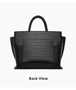 Back view of high-capacity tote with crocodile embossed texture and leather patchwork