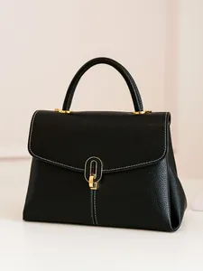 Women's black pebbled leather handbag with contrast stitching and gold metal hardware