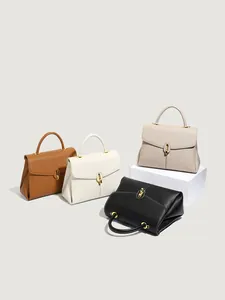Women's textured flap handbags in brown, white, and black with gold U-shaped metal buckles