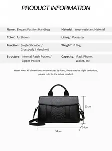 Detail view of black embossed snakeskin tote bag showing dimensions and internal capacity