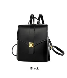 Detail view of the black leather backpack featuring a golden square twist lock closure