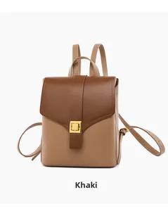Front detail of khaki backpack with brown flap and gold square metal turn-lock