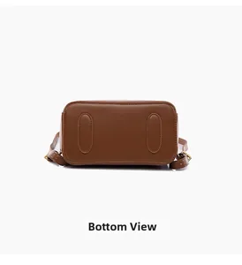 Detailed bottom view of brown leather backpack with reinforced stitching and premium texture