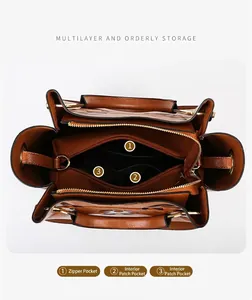 Detail view of large brown leather bucket bag showing internal zipper and slip pockets
