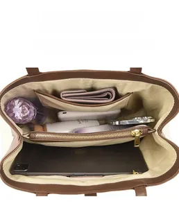 Top view of brown tote bag showing multi-compartment interior for iPad and essentials