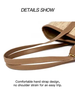Detail of premium tote bag handles with golden metal hooks and classic pattern