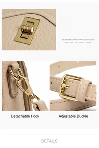 Details von goldenen Metallbeschlägen und verstellbaren Schnallen an beiger Ledertasche