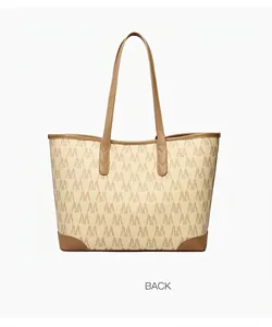 Close-up back view of a large tote bag featuring brown monogram print and leather trim