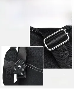 Detail of black pebbled leather texture with white stitching and silver metal hardware