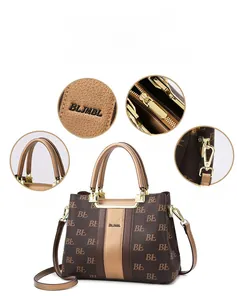 Detail of vintage monogram tote bag featuring golden hardware and sturdy top handles