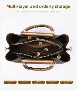 Macro view of multi-compartment interior layout in a classic patterned tote bag