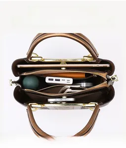 Interior view of leather tote bag showing organized multi-layer storage and large capacity
