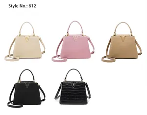 Detail view of five bucket bags with metal V logos in litchi and crocodile textures