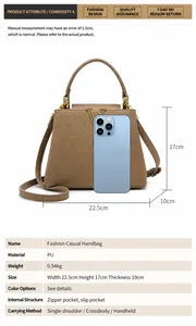 Brown PU leather bucket bag size comparison with a smartphone showing 22.5cm width