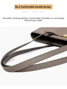 Detail of soft leather shoulder strap with neat stitching on an oversized tote bag