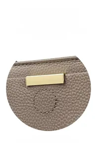 Detail of grey pebbled leather tote with golden rectangular hardware and stitching