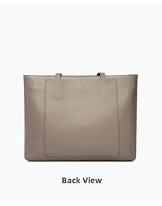 Detail view of the gray tote bag back panel featuring a large functional slip pocket
