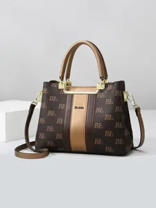 Brown monogram tote bag with gold-tone hardware and top handles for women