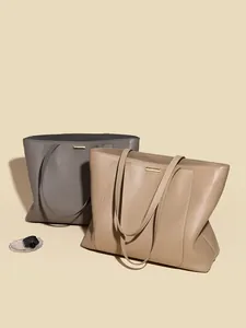 Minimalist large leather tote bags in grey and apricot with pebble grain texture