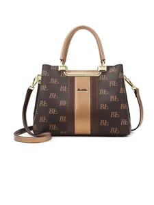 Brown monogram tote bag with gold stripe and dual handles in premium faux leather