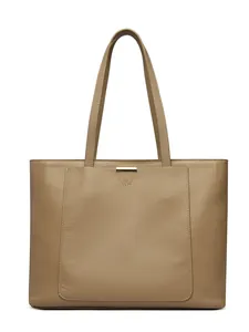 Minimalist light brown leather tote bag with large front pocket and gold hardware detail
