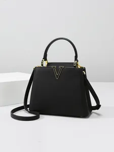 Elegant black lychee leather bucket bag with golden V-logo and versatile top handle strap