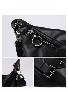 Detail view of premium black leather bag with metal zipper, hook and adjustable buckle