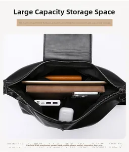 Vertical view of the black leather tote bag showing large capacity and multi-layer storage