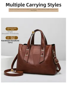 Detail of vintage brown leather tote bag showing textured stitching and golden hardware