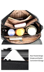 Detail van zwarte crossbodytas van generfd leer met meerdere binnenvakken en ritssluiting