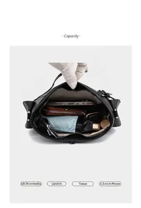 Interior view of leather shoulder bag showing large capacity for umbrella and phone