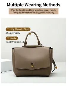 Taupe matte leather handbag detail showing the detachable strap and top handle options