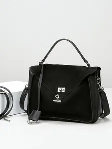 Minimalist black matte leather satchel bag with silver hardware and top handle for women