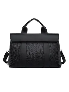 Chic black leather handbag with woven pattern texture and adjustable shoulder strap