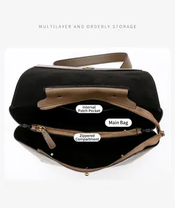 Macro view showing the spacious interior compartment and multiple pockets of the leather tote bag
