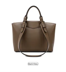 Detailed back view of the brown leather handbag showing smooth texture and handles