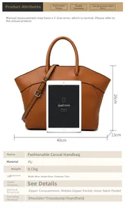 Detail view of large brown wing tote bag showing size with tablet for scale comparison