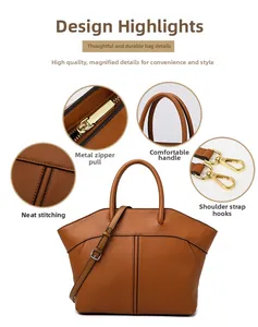 Detail view of brown leather tote showing gold metal zipper and reinforced stitching