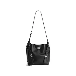 Close-up of black leather shoulder bag with silver turn-lock and geometric metal buckle detail