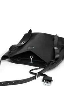 Minimalist black leather shoulder bag with silver hardware and adjustable straps