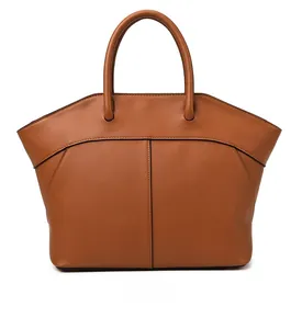 Detail view of the back of a caramel brown leather tote bag with elegant stitching