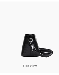 Side view of black genuine leather crossbody bag with cracked texture and silver metal hook