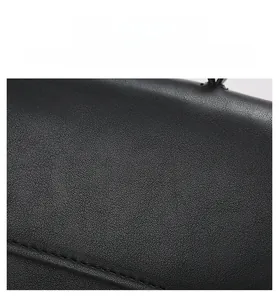 Detailed macro view of the premium black leather texture and precise stitching craftsmanship